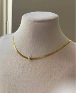 Elegant Gold Herringbone Necklace with Teardrop Emerald and White Pendant - Image 2